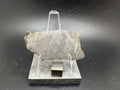 Kaali järv iron meteorite slice on display stand, front view