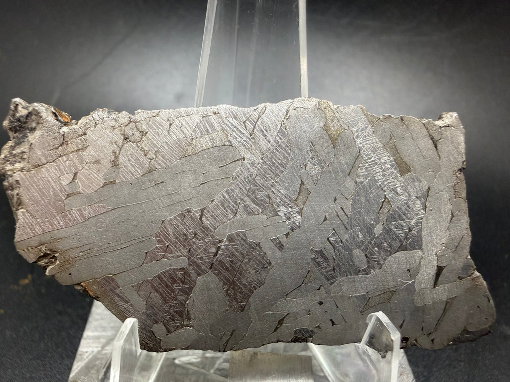 Kaali järv iron meteorite 24.92g slice showing full Widmanstätten pattern on acrylic display stand