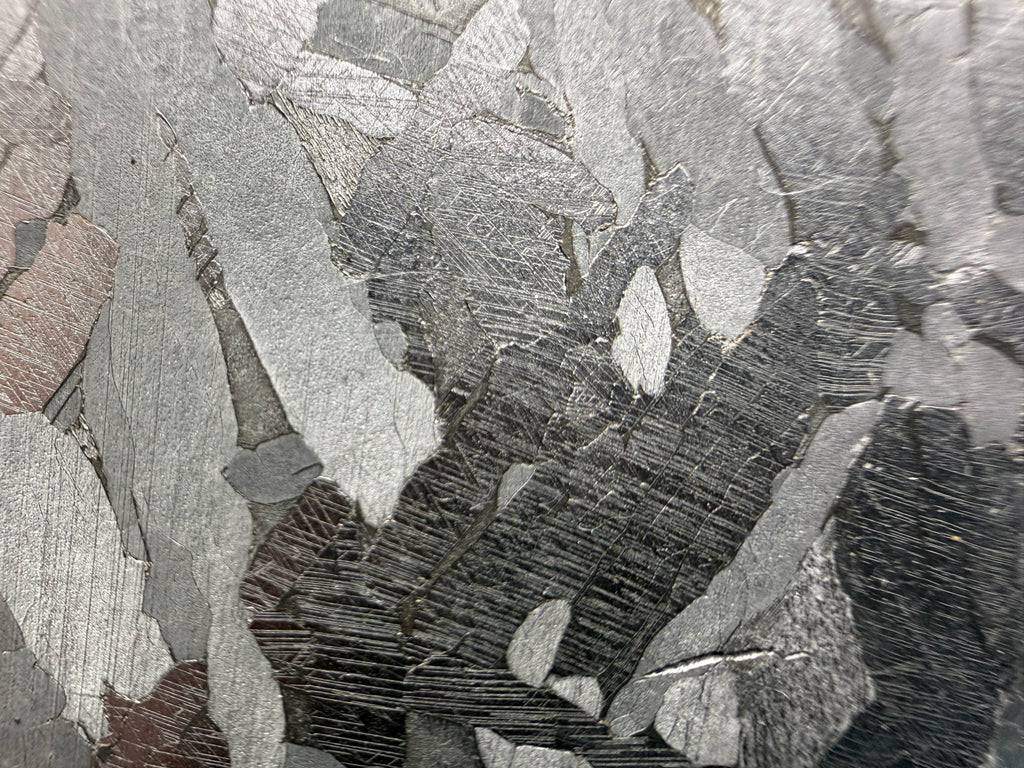 Kaalijärv iron meteorite 38.39g -- close view of parallel Neumann bands within individual kamacite plates