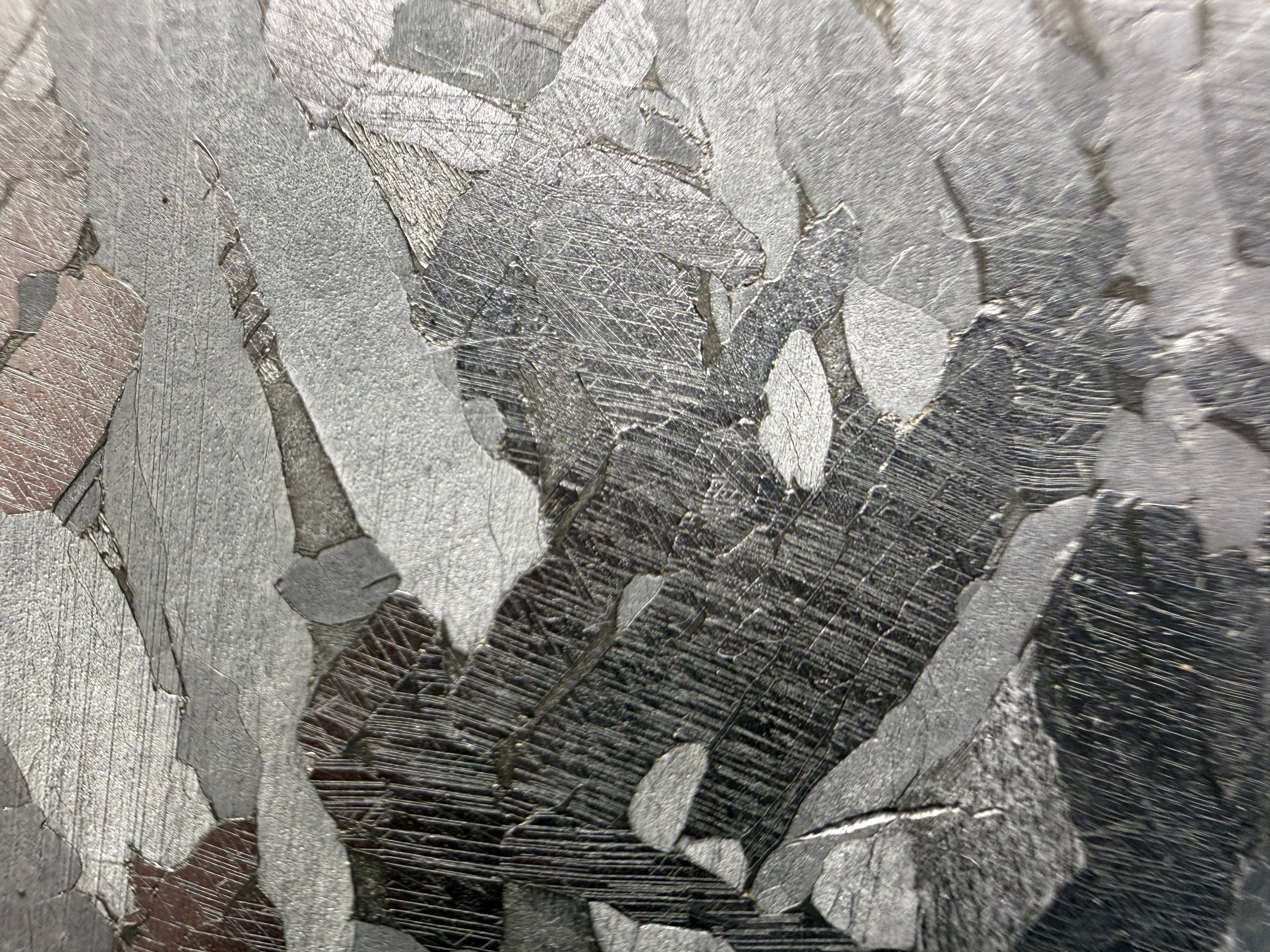 Kaalijärv iron meteorite 38.39g -- close view of parallel Neumann bands within individual kamacite plates