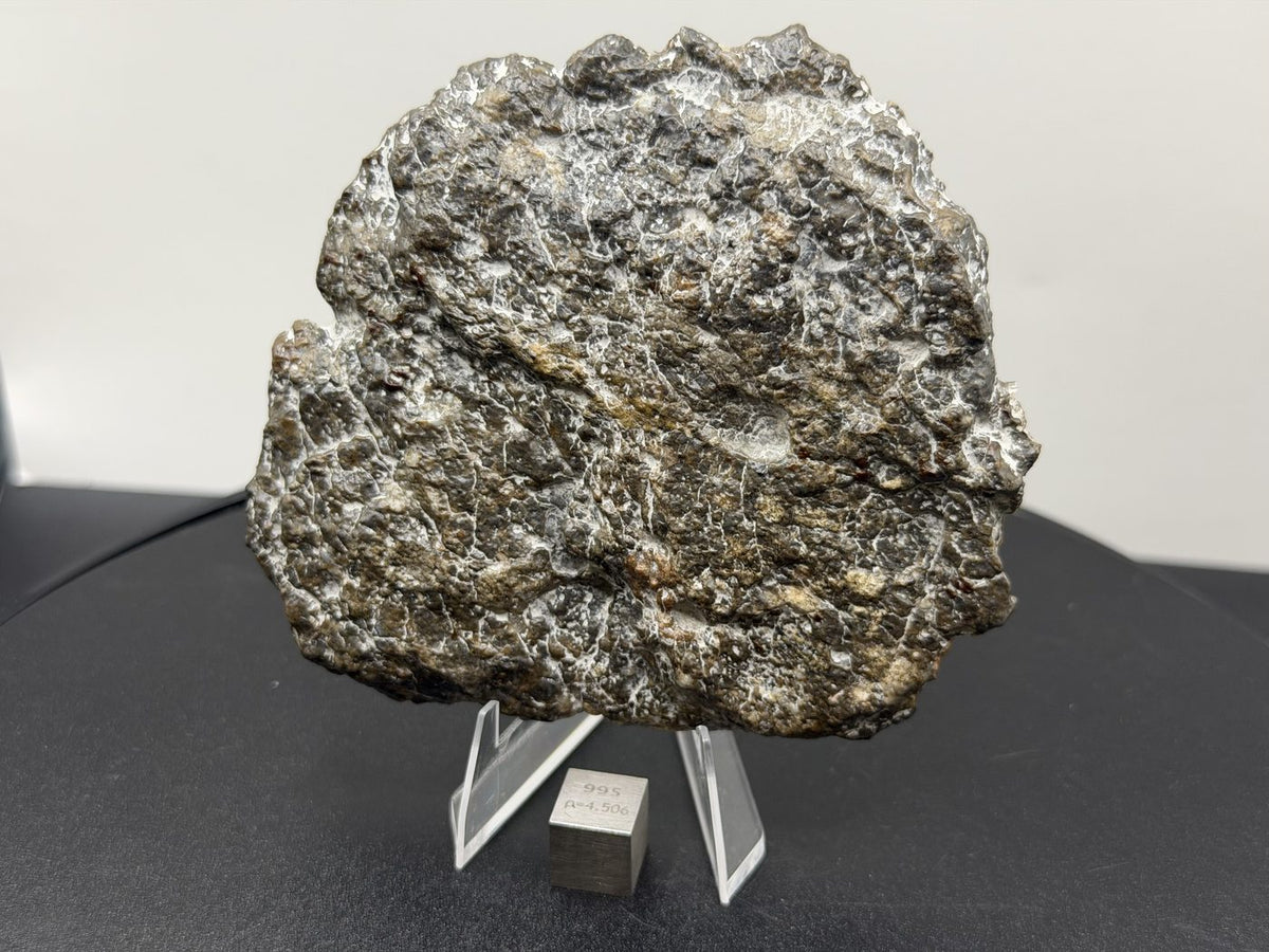 Laayoune 002 lunar meteorite end cut, 116.40 g, uncut reverse showing the natural exterior surface
