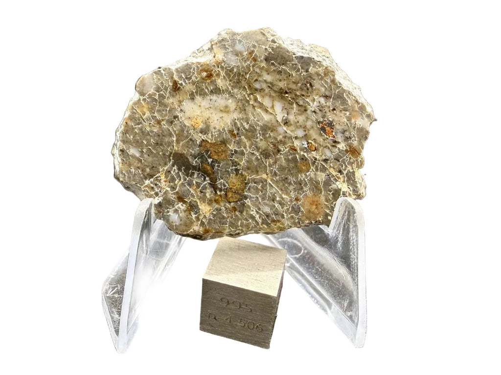 Laayoune 002 lunar feldspathic breccia full slice on a display stand with a scale cube