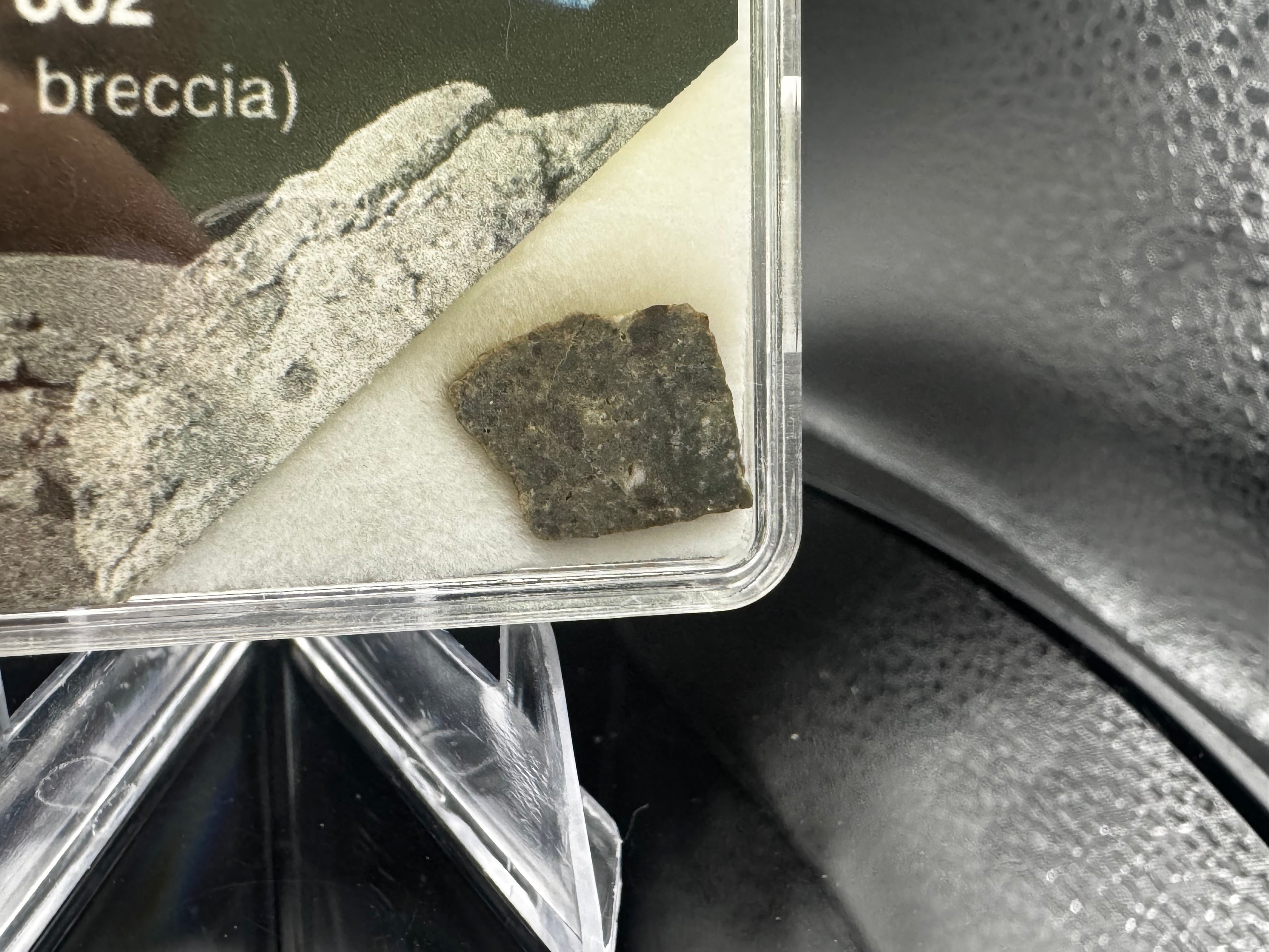 Laâyoune 002 lunar meteorite slice in small display box angled view