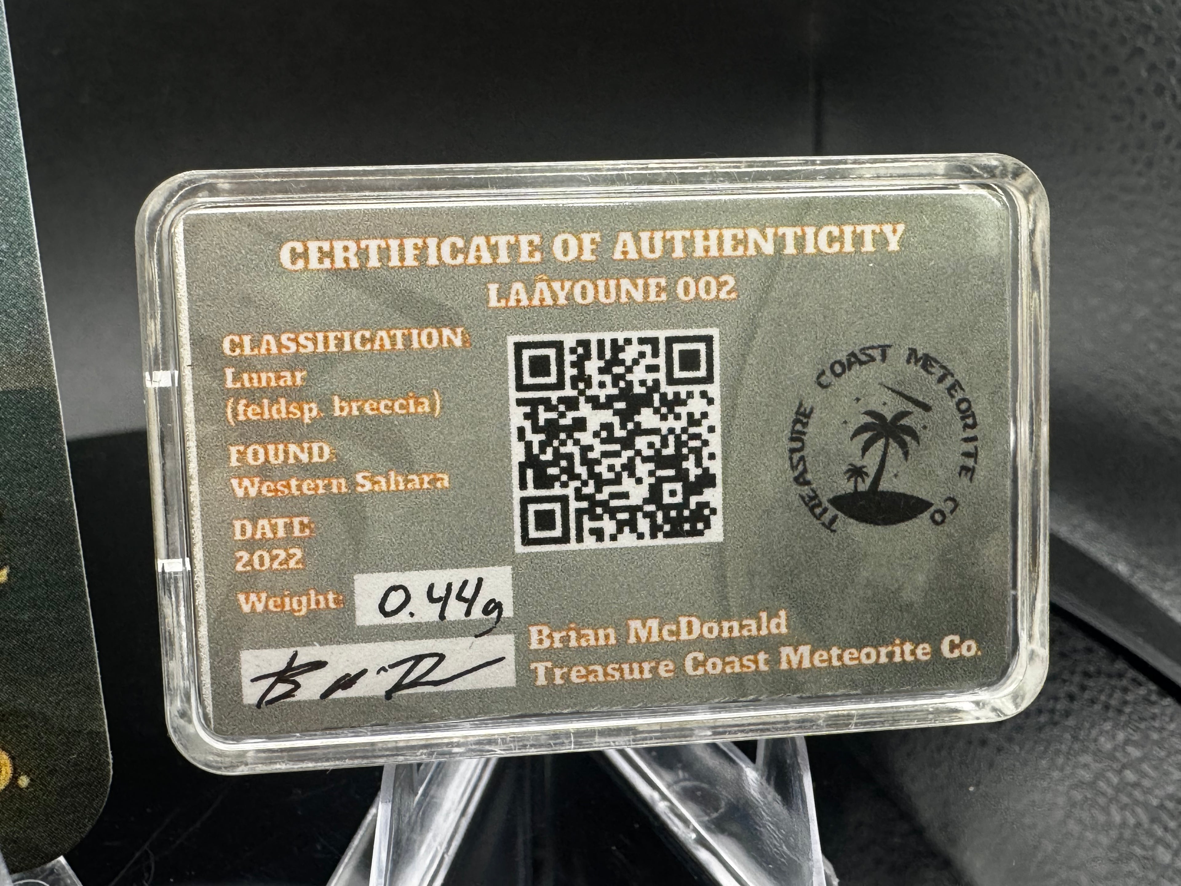 Laâyoune 002 lunar meteorite display box with certificate-style specimen card