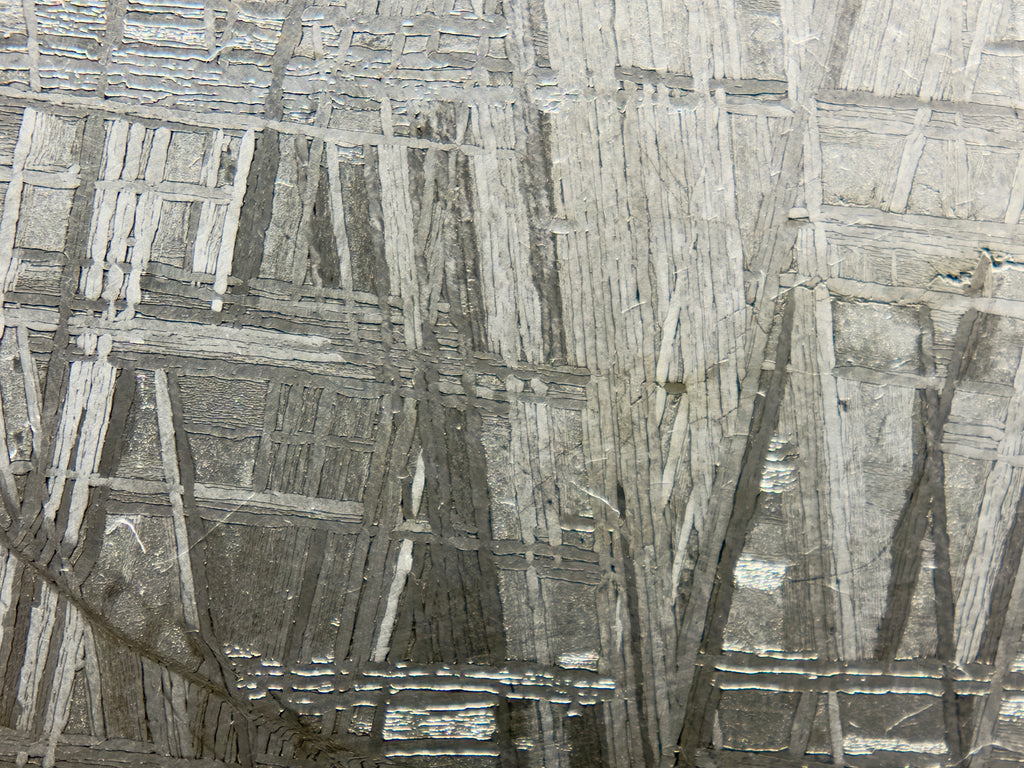 Close view of Muonionalusta IVA fine octahedrite iron meteorite showing etched crystal structure, 292.00g