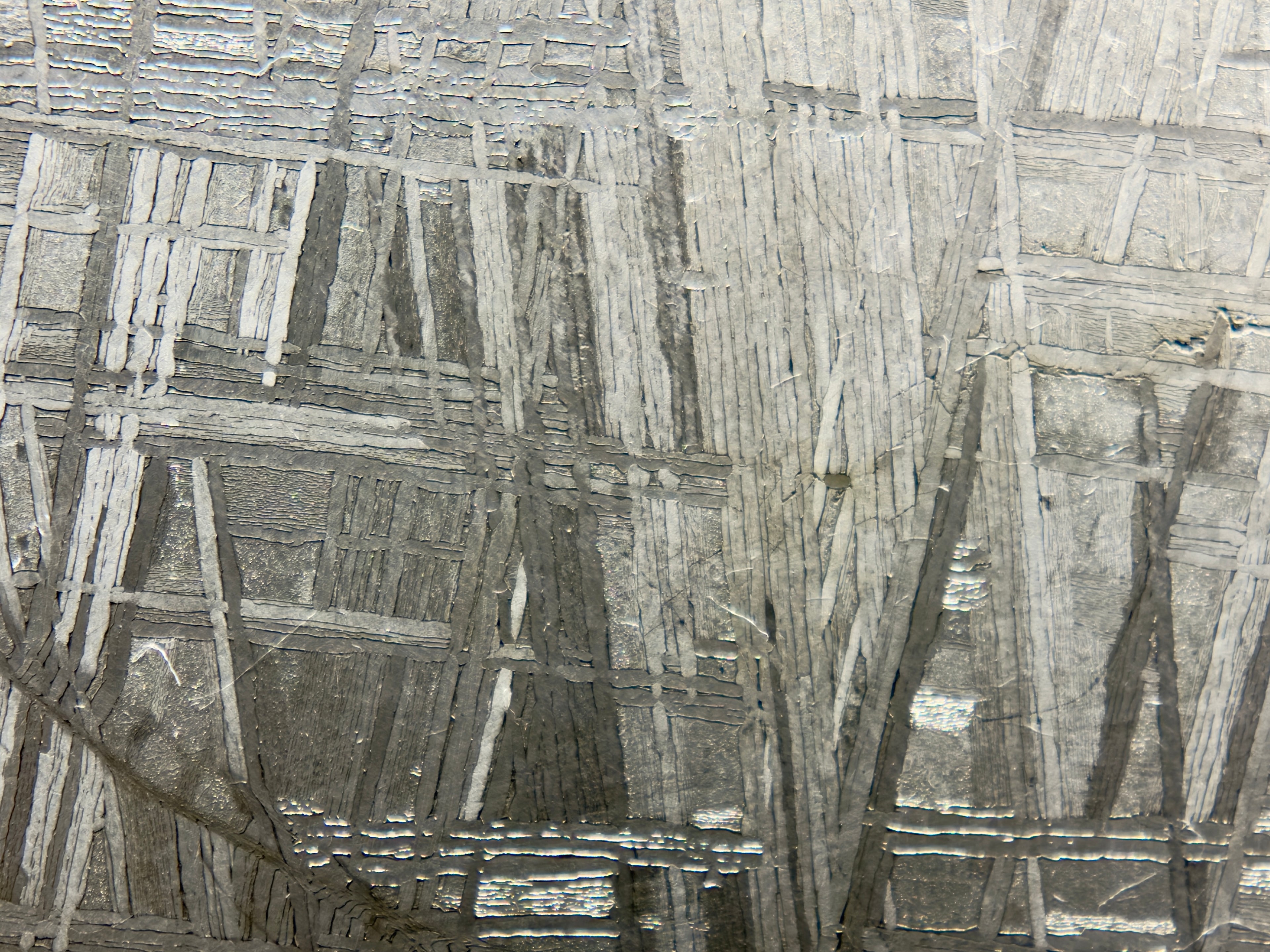 Close view of Muonionalusta IVA fine octahedrite iron meteorite showing etched crystal structure, 292.00g