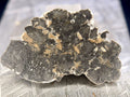 NWA 17706 lunar meteorite slice, 1.39g, irregular troctolitic anorthosite melt breccia with light clasts and tan veining