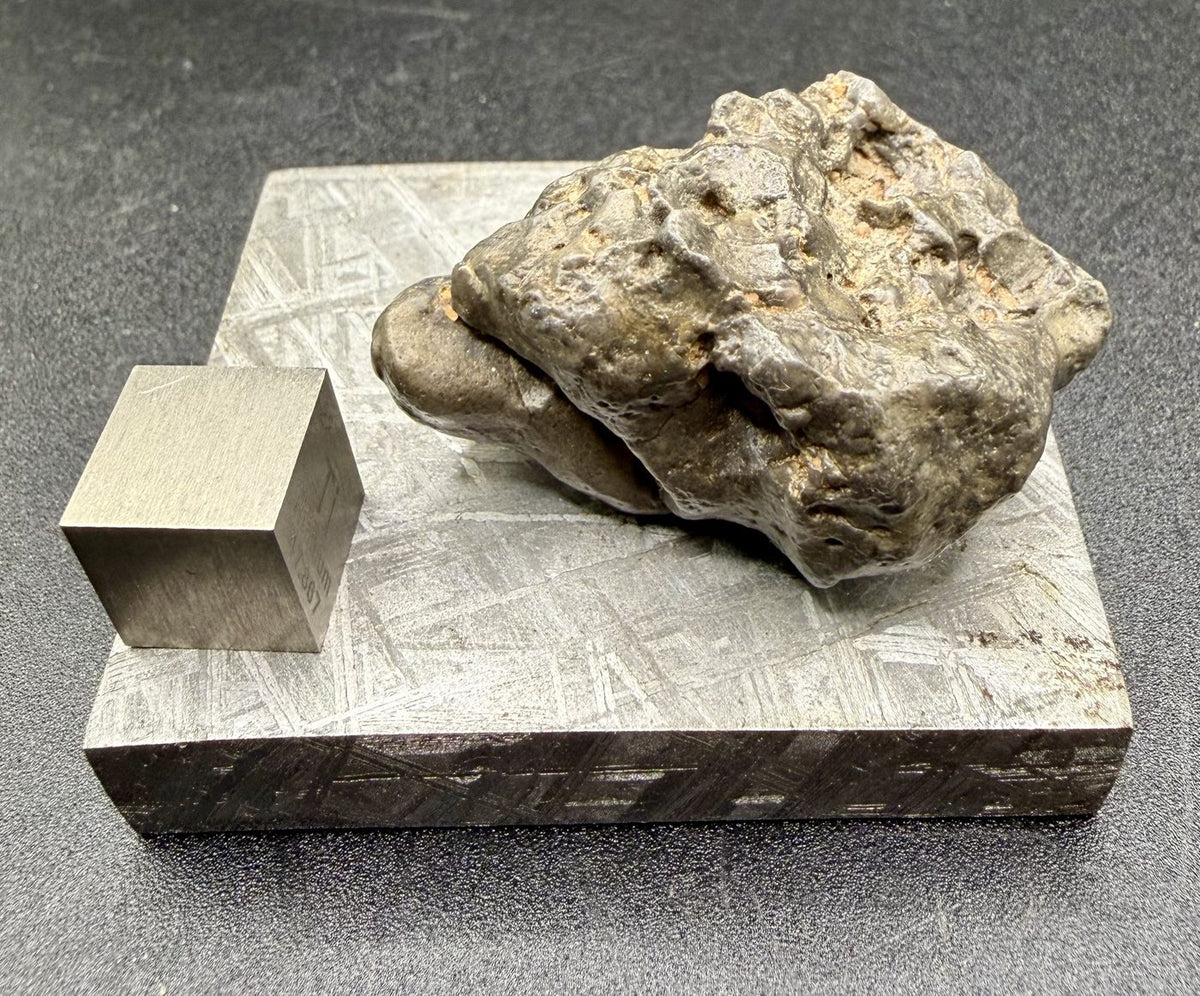 Side profile of the NWA 17706 lunar complete individual, showing its natural weathered surface