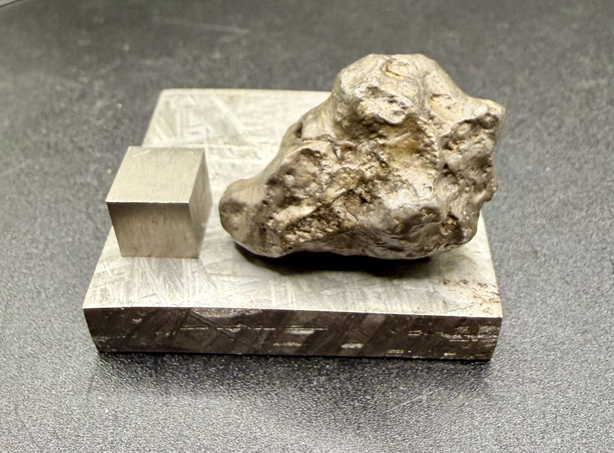 NWA 17706 lunar complete individual from an angle, gray varnished surface and deep pitting