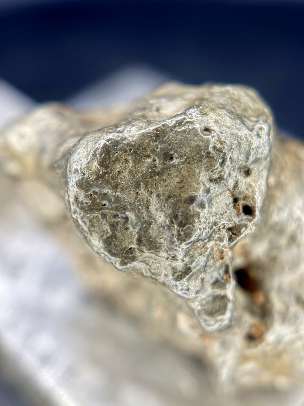 Close-up of a varnished lobe on the NWA 17706 lunar meteorite individual