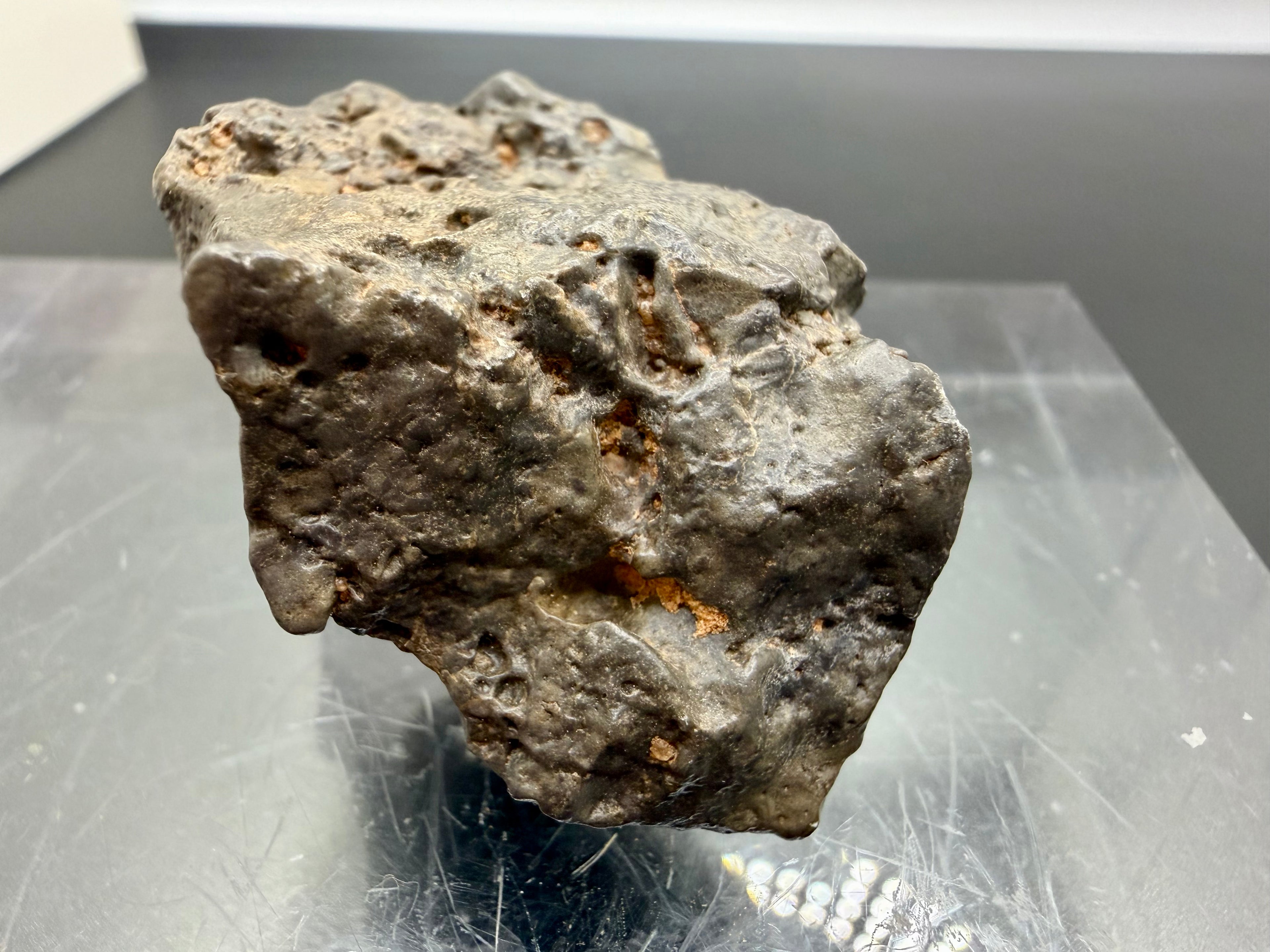 NWA 17706 rare lunar meteorite 45.40g underneath view showing natural surface