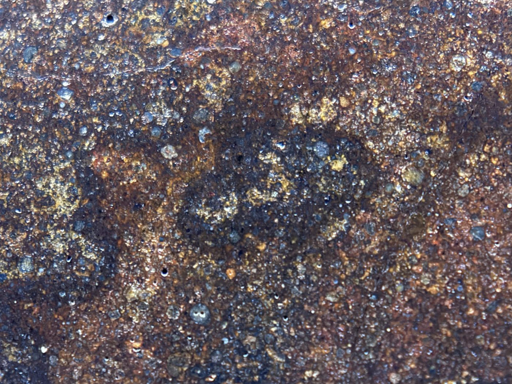 Macro detail of NWA 17916 CO3 carbonaceous chondrite meteorite showing individual chondrules in grey and olive against the matrix, 11.28g