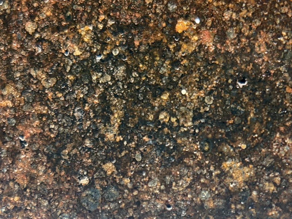Macro view of NWA 17916 CO3 carbonaceous chondrite meteorite showing fine grained matrix with dispersed opaque grains, 11.28g