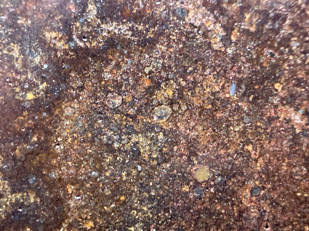 Macro view of NWA 17916 CO3 carbonaceous chondrite meteorite showing closely spaced rounded chondrules on the polished face, 13.00g