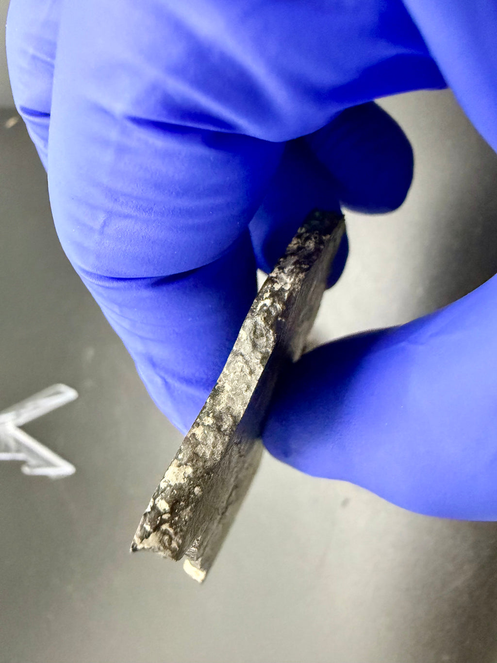 NWA 17920 polished meteorite slice edge profile showing thickness