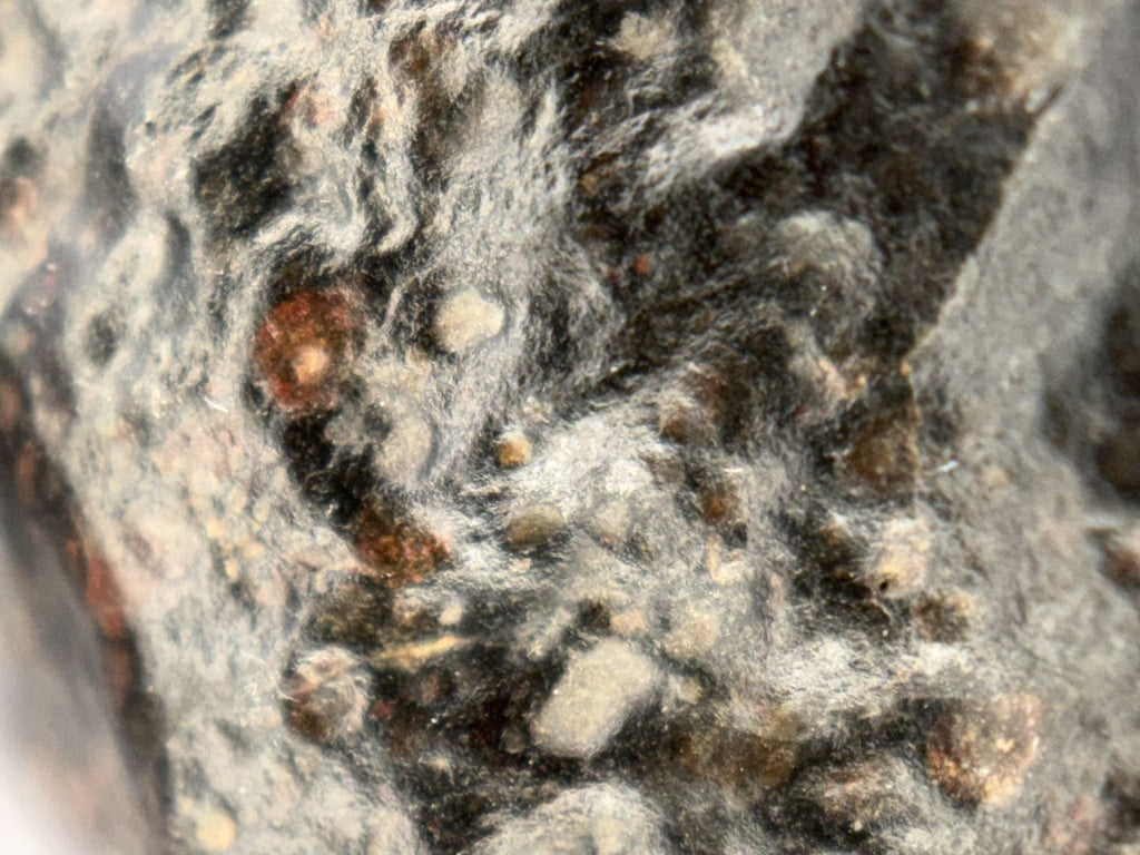 Surface texture detail of the natural exterior of NWA 18497 CVox3 carbonaceous chondrite