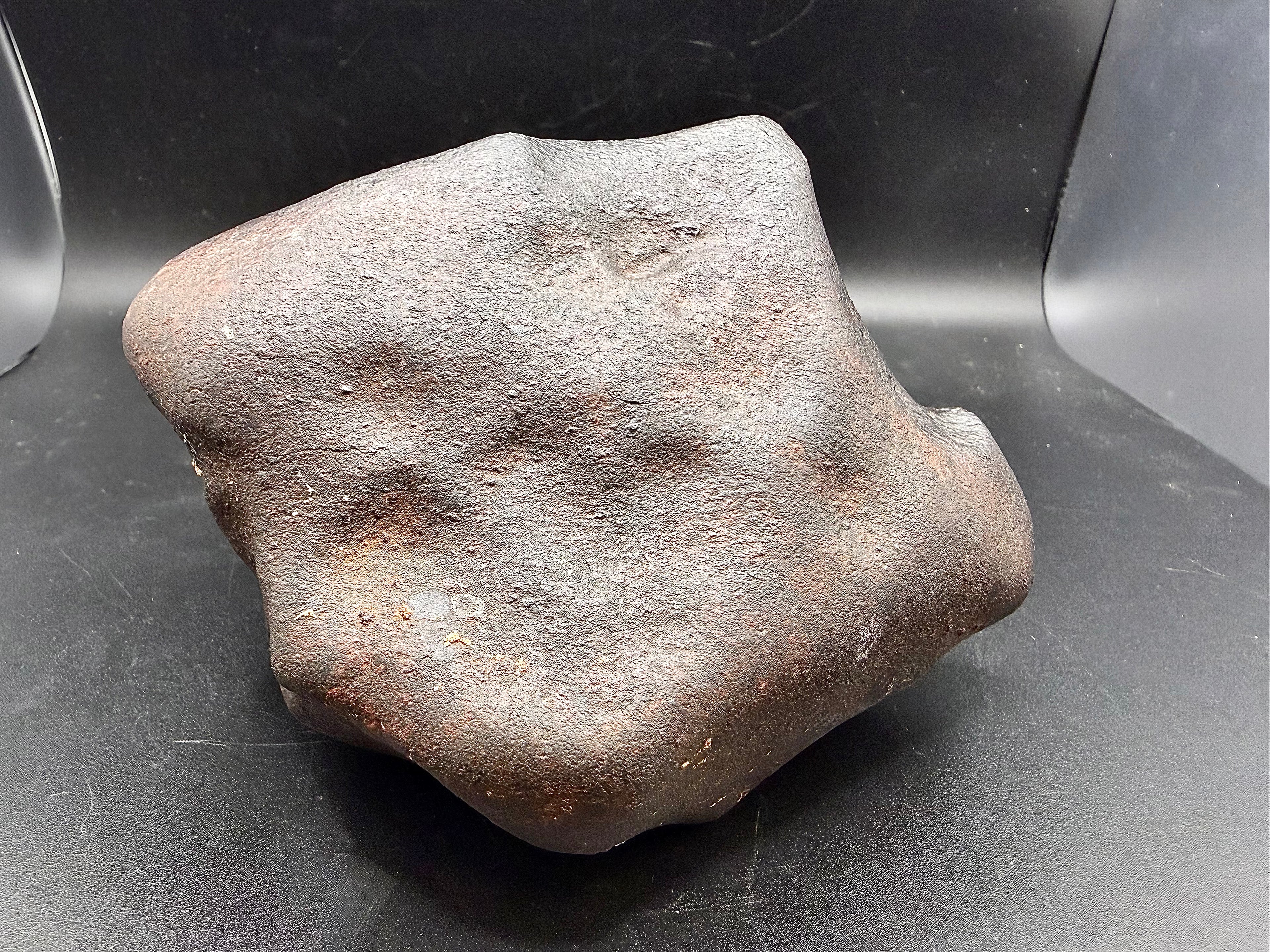 Leading face of oriented NWA ordinary chondrite meteorite showing atmospheric ablation shaping