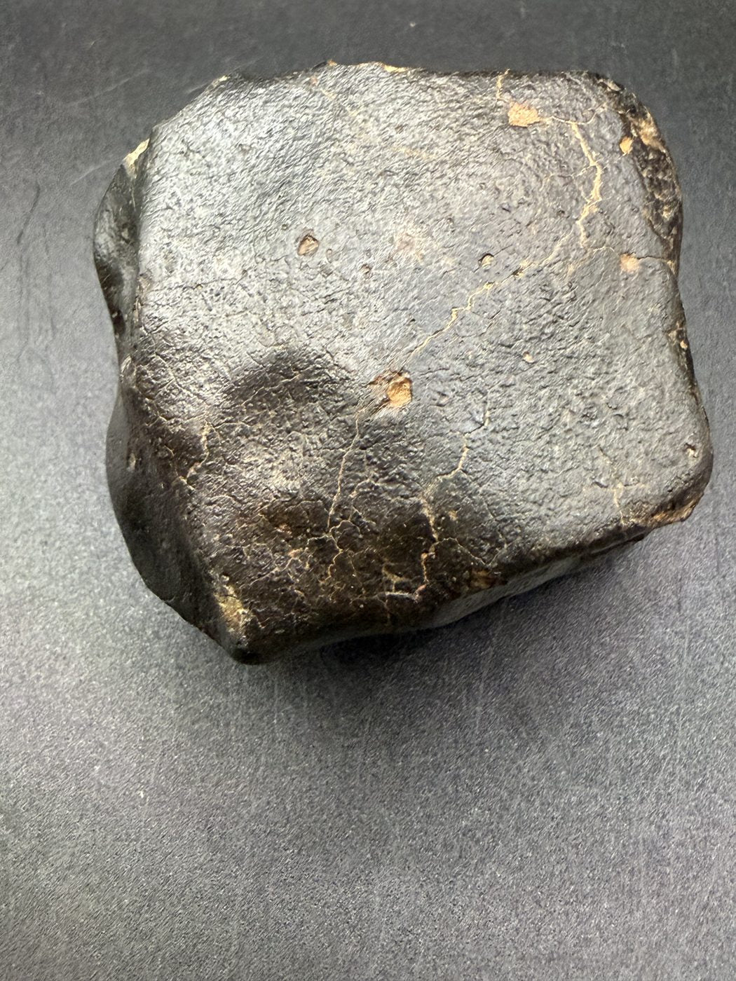 Smooth face of fresh black fusion crust, NWA XXX unclassified ordinary chondrite, 392.28g