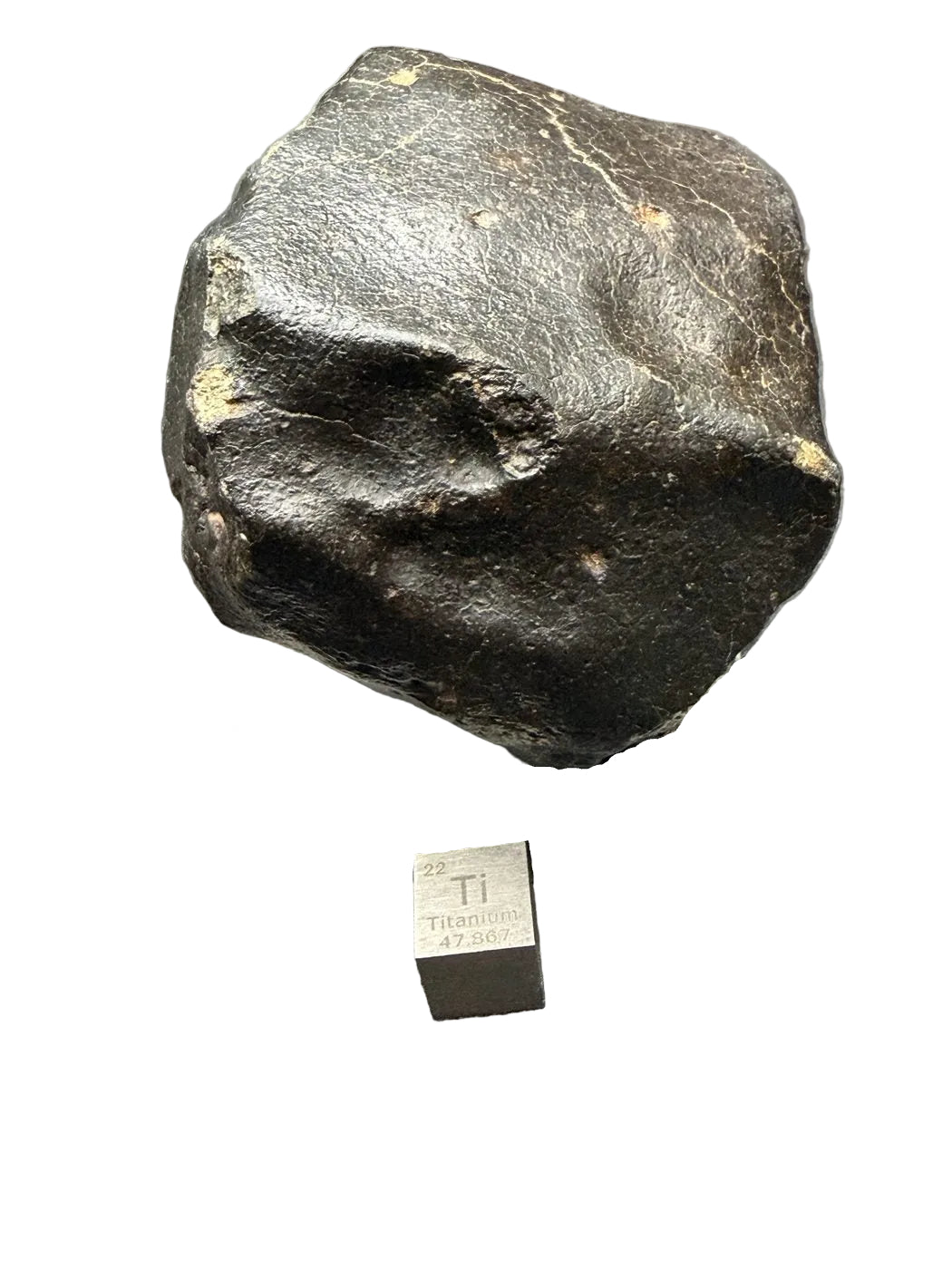 Second view of NWA XXX ordinary chondrite individual showing black fusion crust and shallow regmaglypts, 392.28g