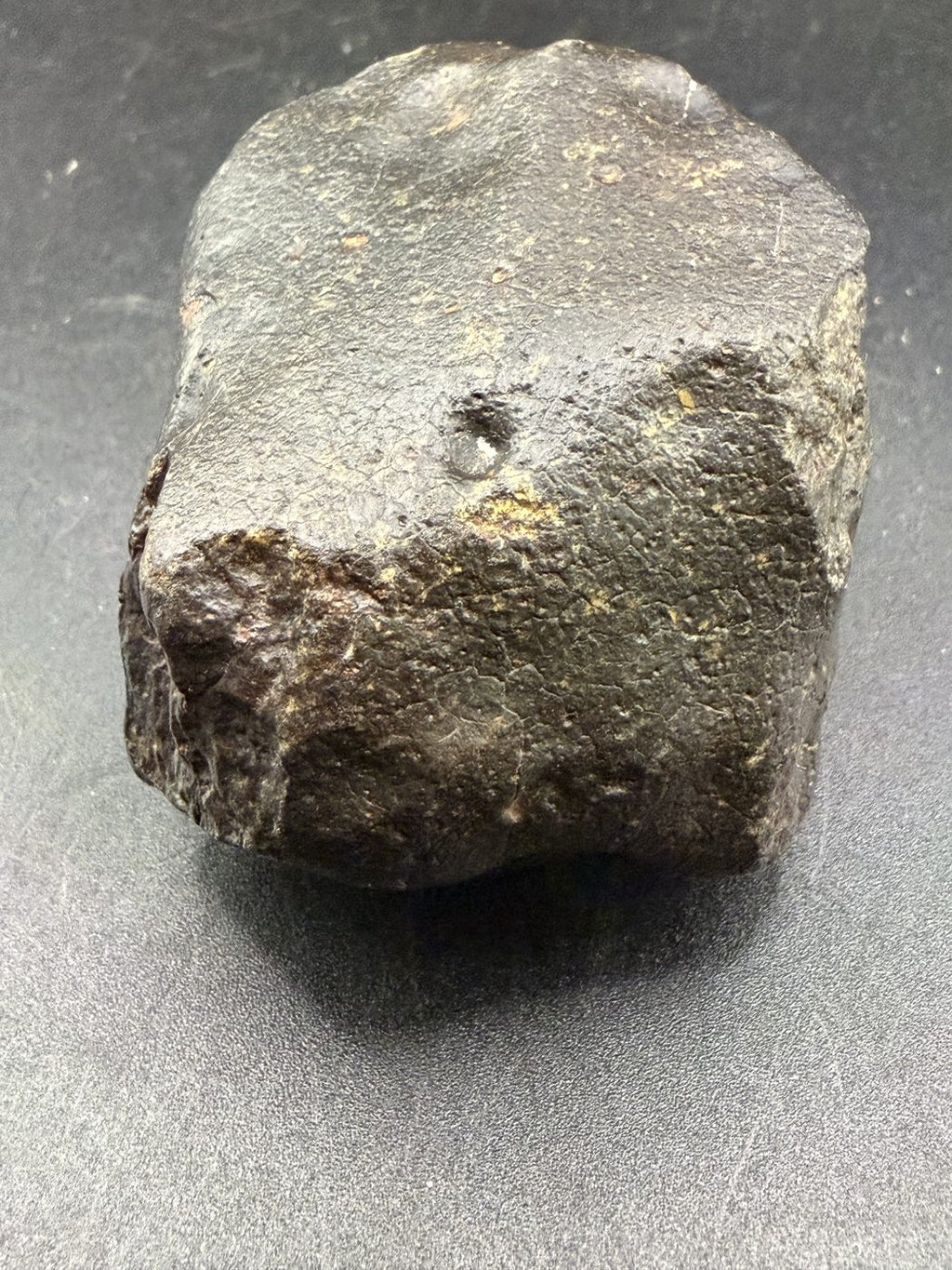 Side face showing fusion crust and slight caliche in recesses, NWA XXX unclassified ordinary chondrite, 392.28g