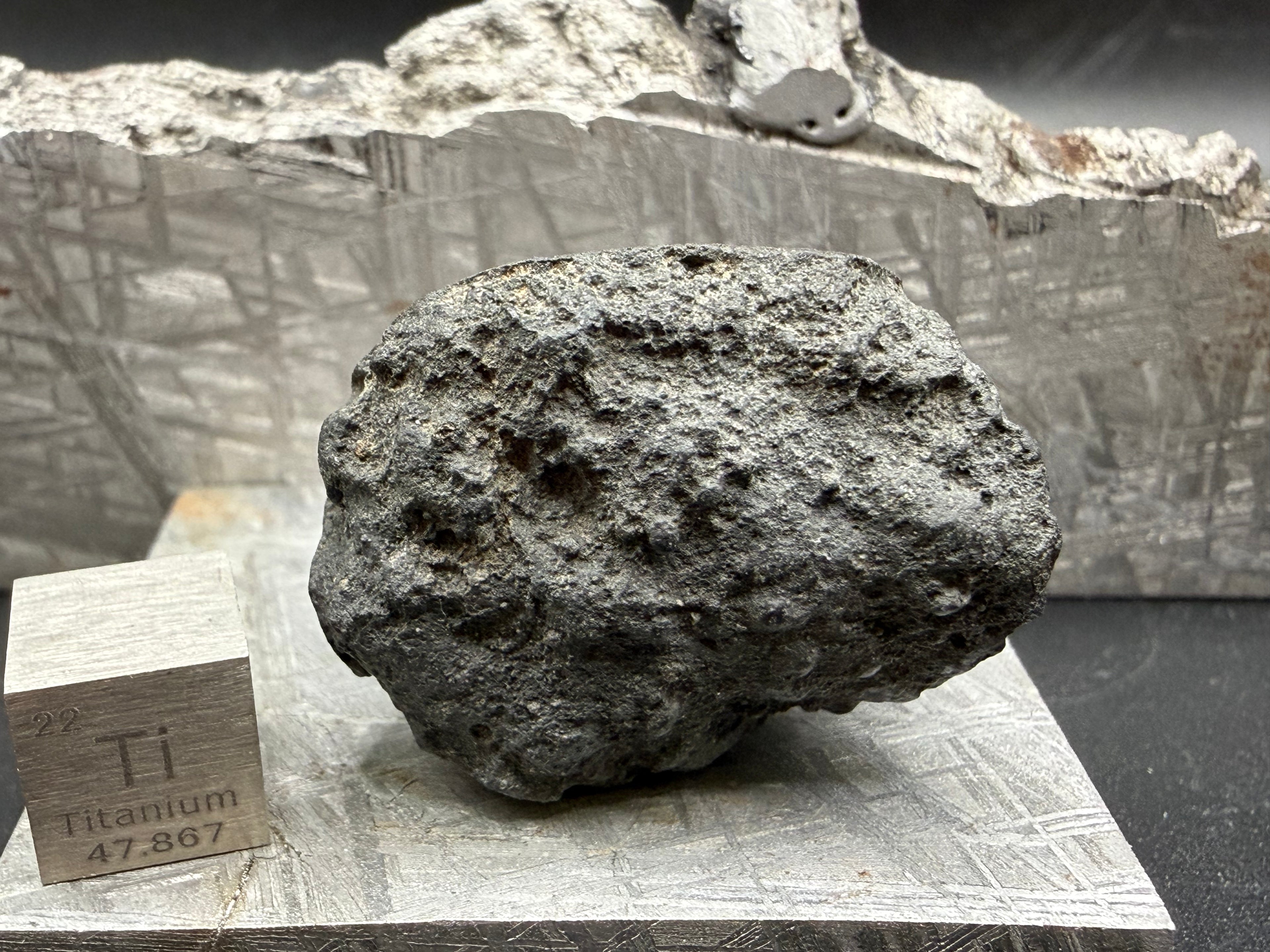 Trailing surface of oriented carbonaceous chondrite meteorite specimen