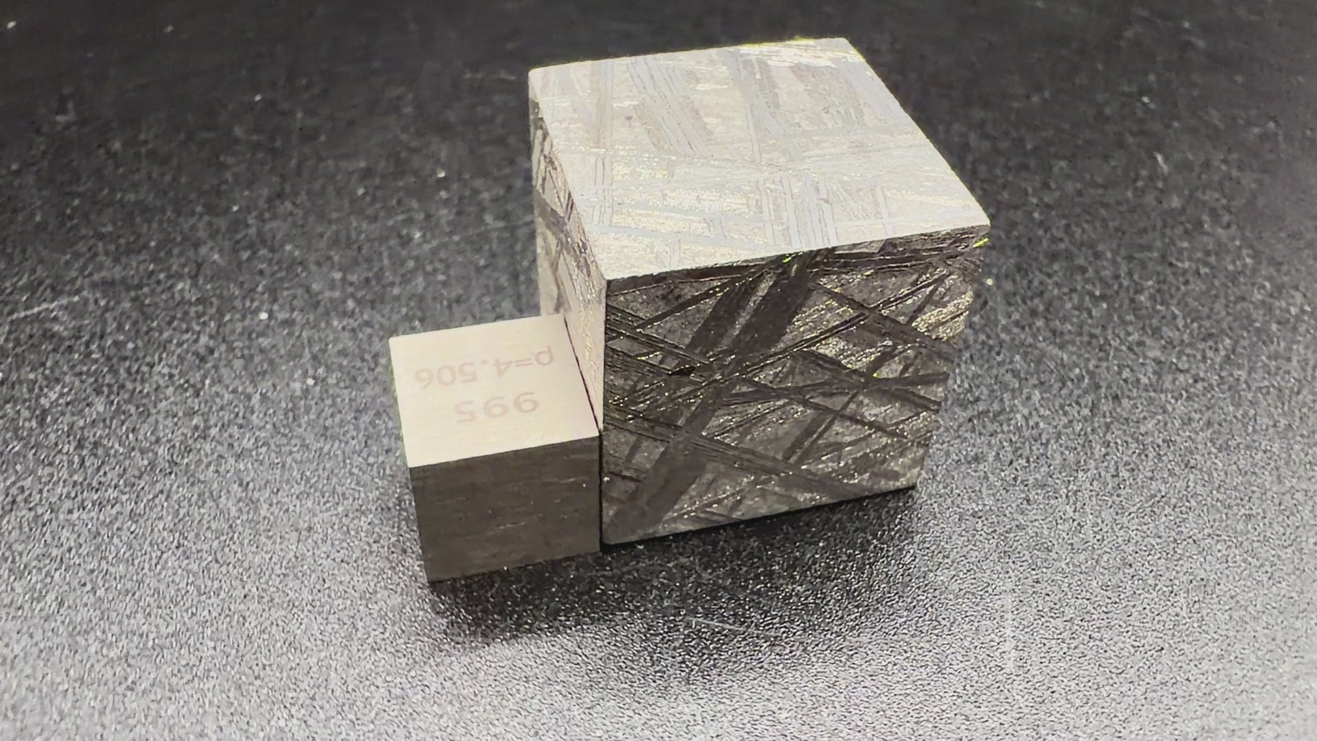 Rotating video of Muonionalusta iron meteorite 2cm cube showing etched Widmanstatten pattern on all faces, 65g