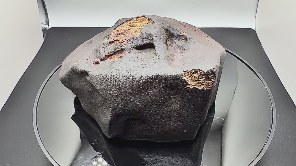 video of rotating meteorite showing crust, and regmaglypts 
