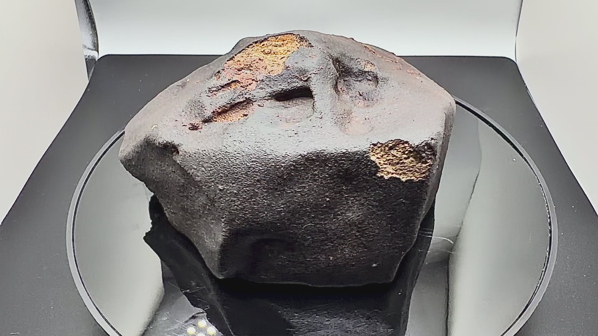 video of rotating meteorite showing crust, and regmaglypts 