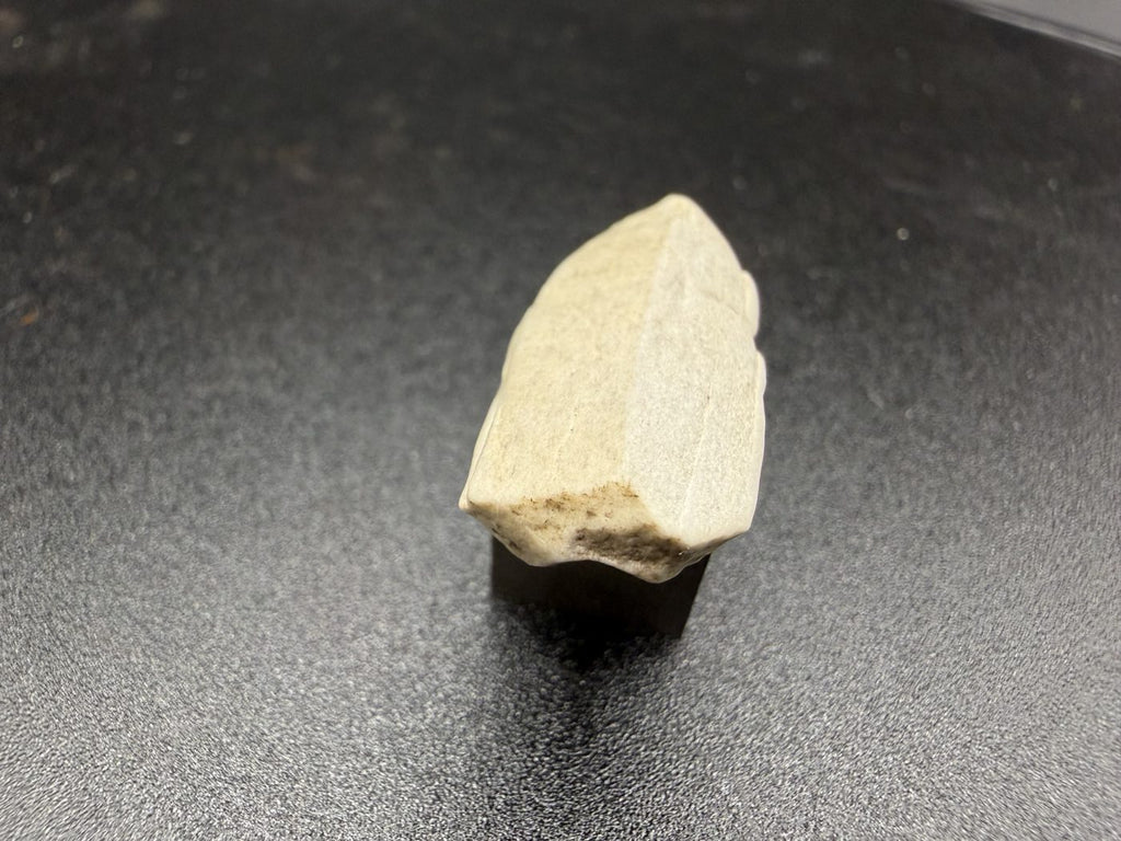 Sebkha el Melah 001 aubrite, 2.51g enstatite crystal showing terminated end and cleavage faces