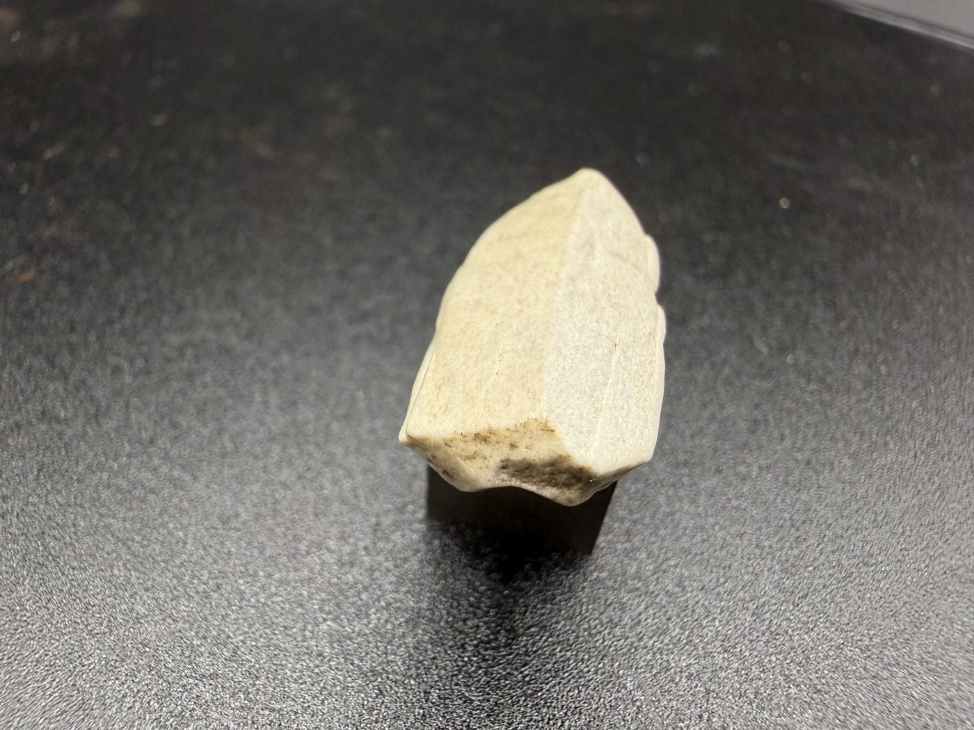 Sebkha el Melah 001 aubrite, 2.51g enstatite crystal showing terminated end and cleavage faces