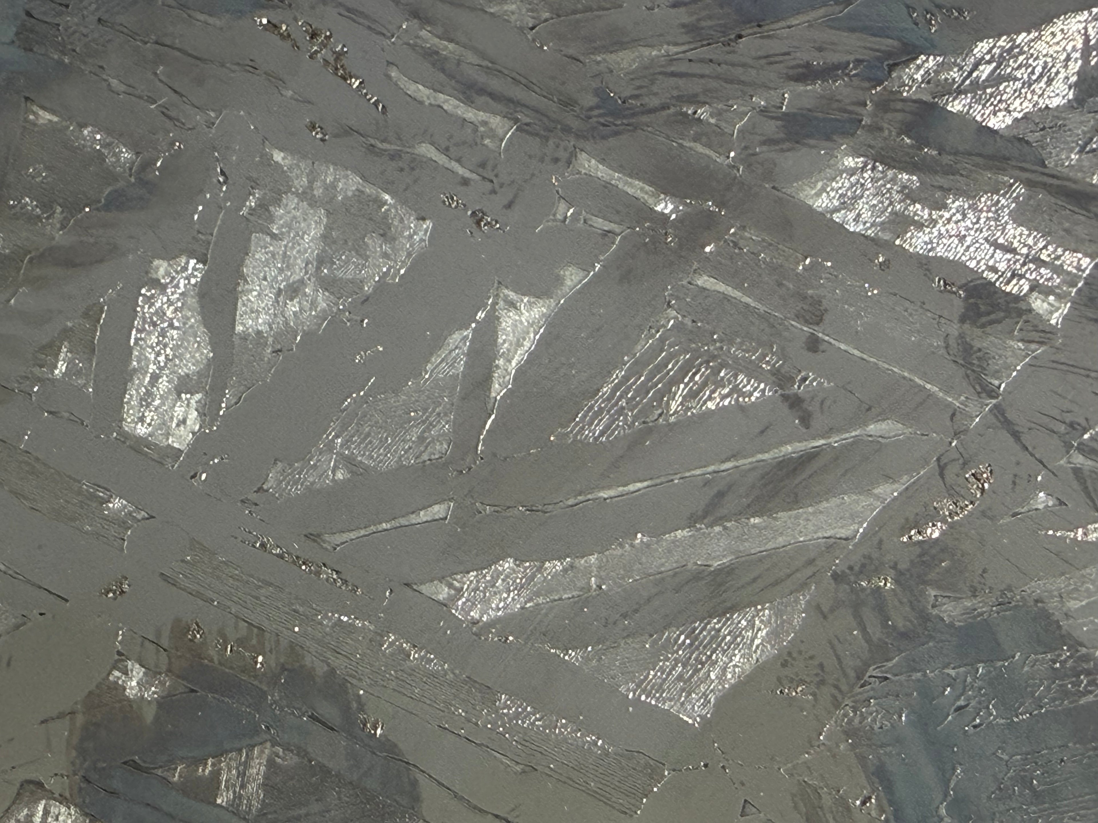 Seymchan pallasite 591g full slice extreme close-up of etched Widmanstätten kamacite and taenite band structure