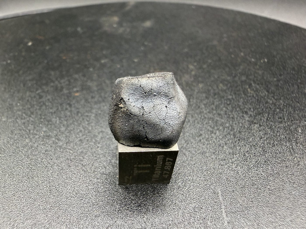 Tarda C2-ungrouped carbonaceous chondrite, 2.03g individual, detail of black fusion crust